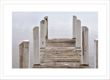 Load image into Gallery viewer, Jetty Photography Wall Art Print of the wooden jetty at Wilson&#39;s Inlet at Pelican Bay, Denmark, Western Australia on a still, grey overcast day. Fine Art Print with White Frame.
