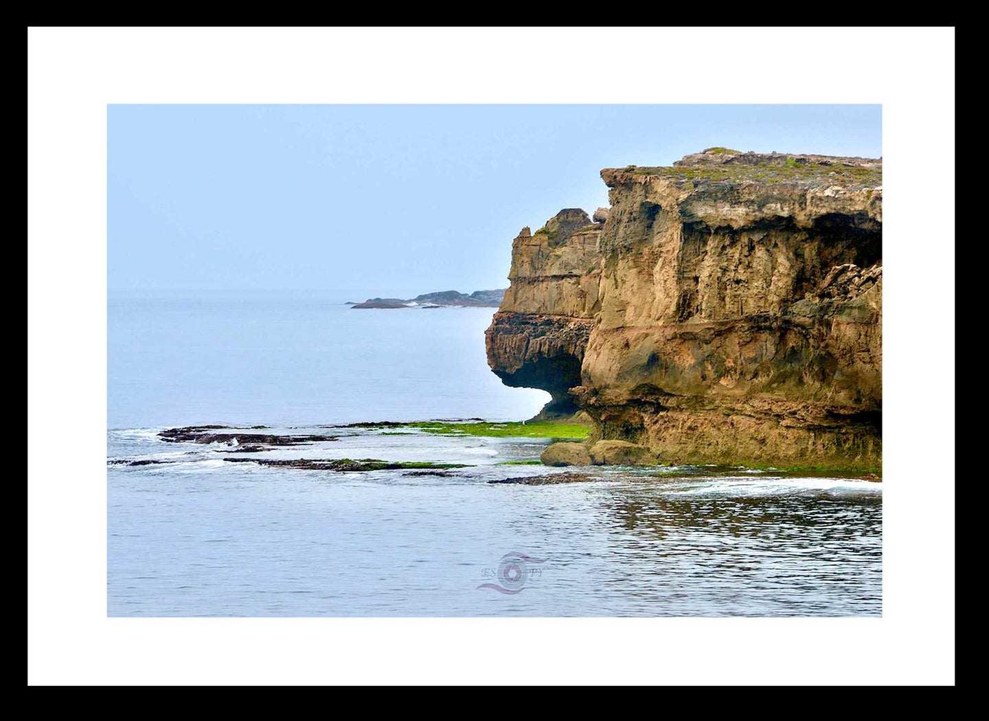 Ocean Photography Wall Art Print of the dramatic and rugged ocean cliffs at Innes Headland, captured in the Innes National Park, South Australia on a grey rainy day. Fine Art Print with Black Frame. 