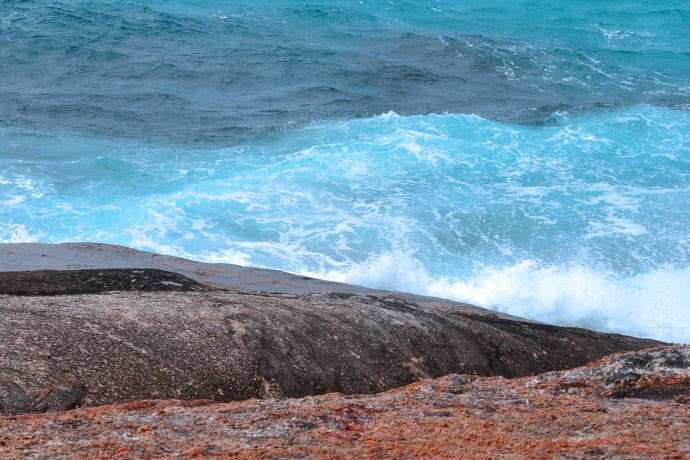 Ocean Photography Wall Art Print of the hypnotic blues of the ocean contrasting with wave drenched rocks, taken at Madfish Bay, Denmark, Western Australia. Unframed Print. 