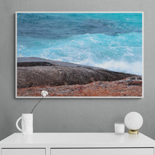 Load image into Gallery viewer, Ocean Photography Wall Art Print of the hypnotic blues of the ocean contrasting with wave drenched rocks, taken at Madfish Bay, Denmark, Western Australia. Canvas Print with White Frame.
