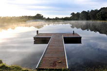 Load image into Gallery viewer, Jetty Photography Wall Art Print of a misty morning sun rise with beautiful reflections on the tranquil lake viewed from the T shaped, peaceful jetty. Unframed Print. 
