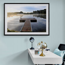 Load image into Gallery viewer, Jetty Photography Wall Art Print of a misty morning sun rise with beautiful reflections on the tranquil lake viewed from the T shaped, peaceful jetty. Fine Art Print with Black Frame.
